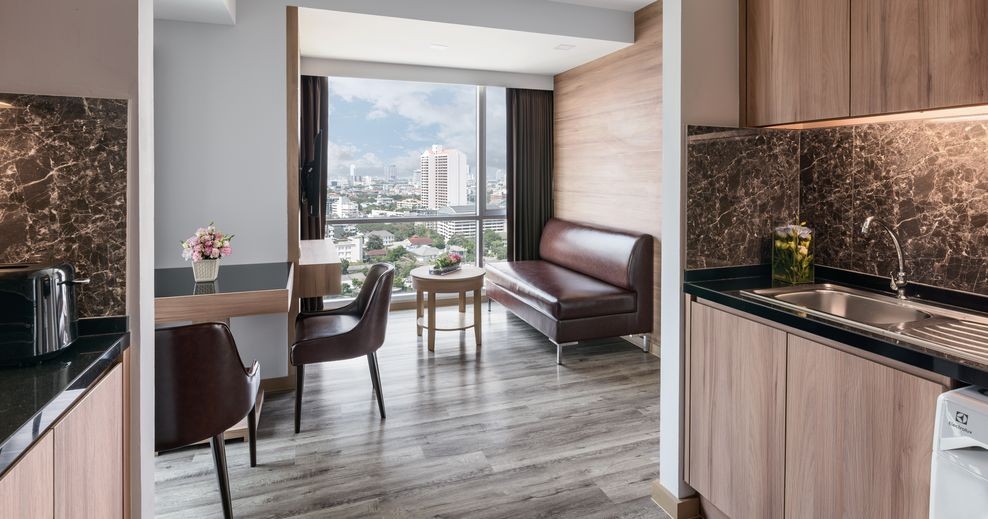 Adelphi Grande Sukhumvit Hotel - Executive One Bedroom Suite Living Area-04_988x519.jpg